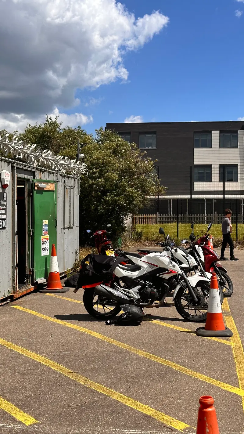 Training motorbikes parked outside the site cabin