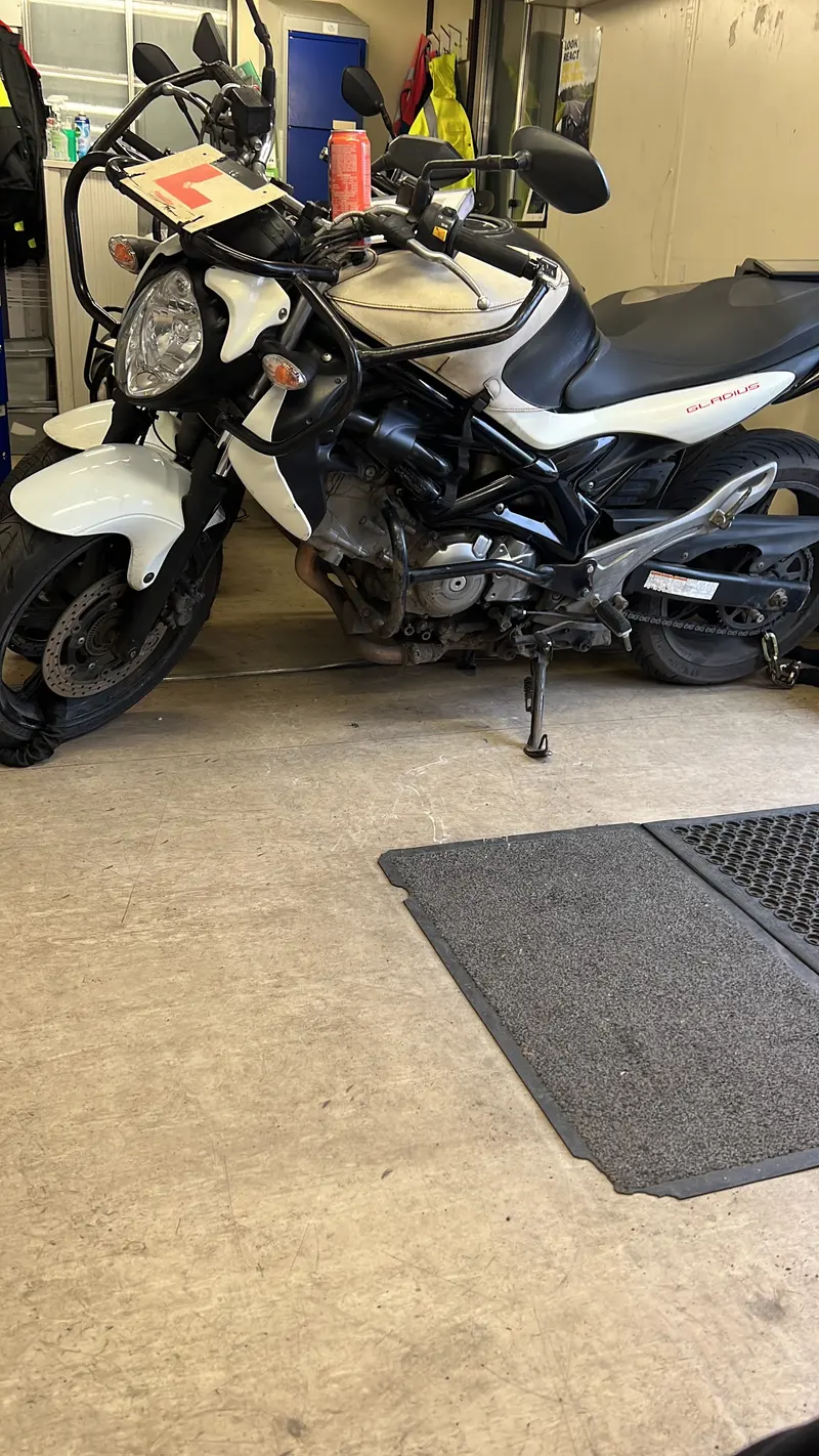 Close-up of a training motorbike on its stand