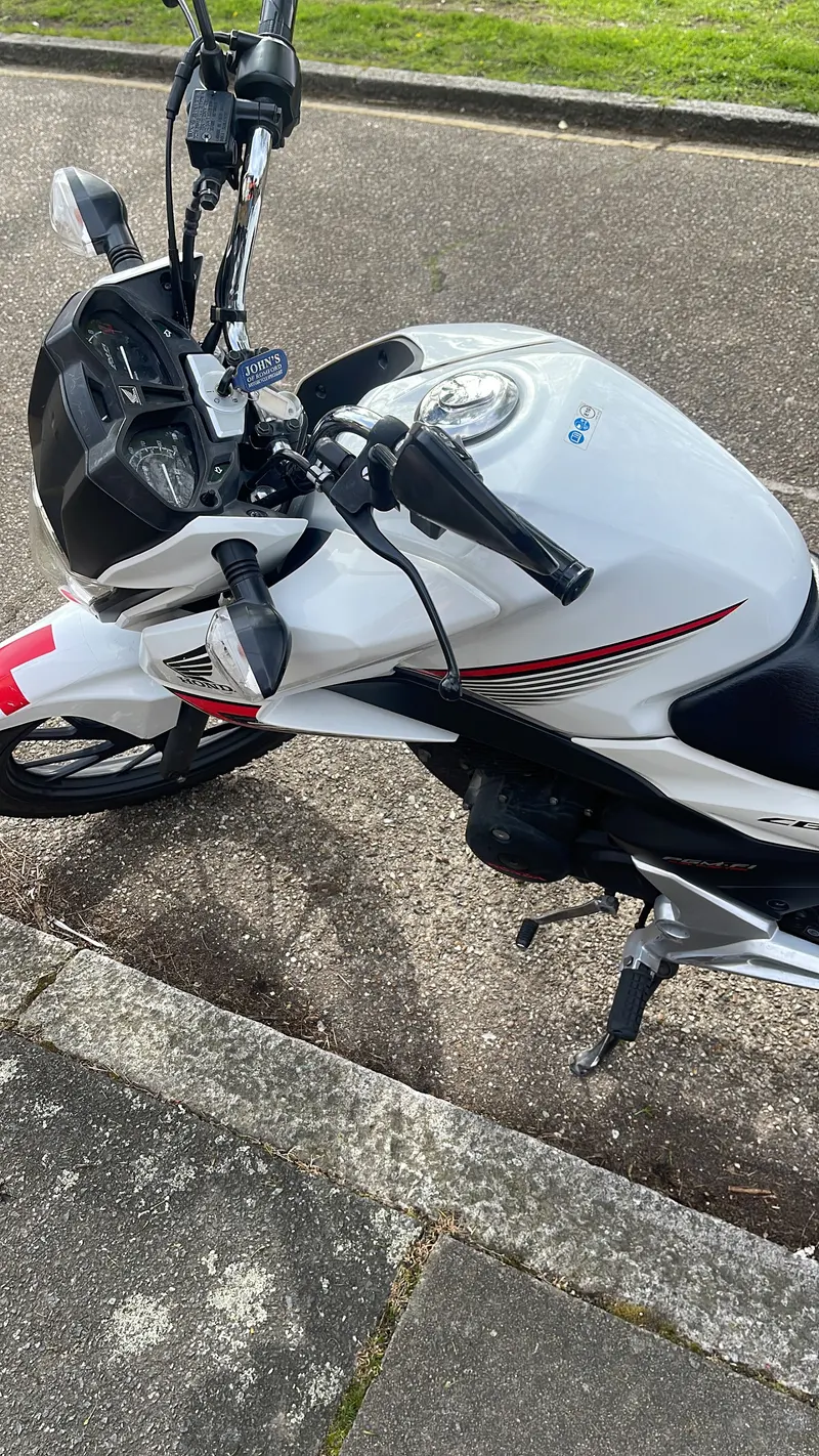 Close-up of a white and red motorbike fairing