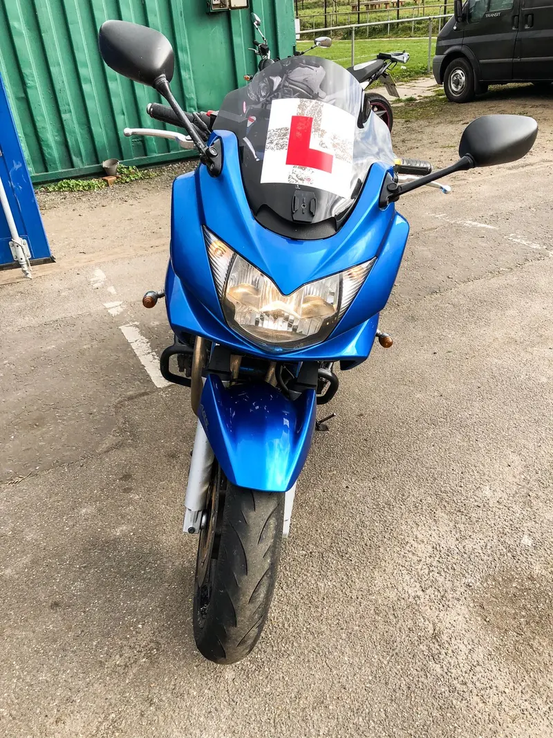 The front of a blue Suzuki Bandit