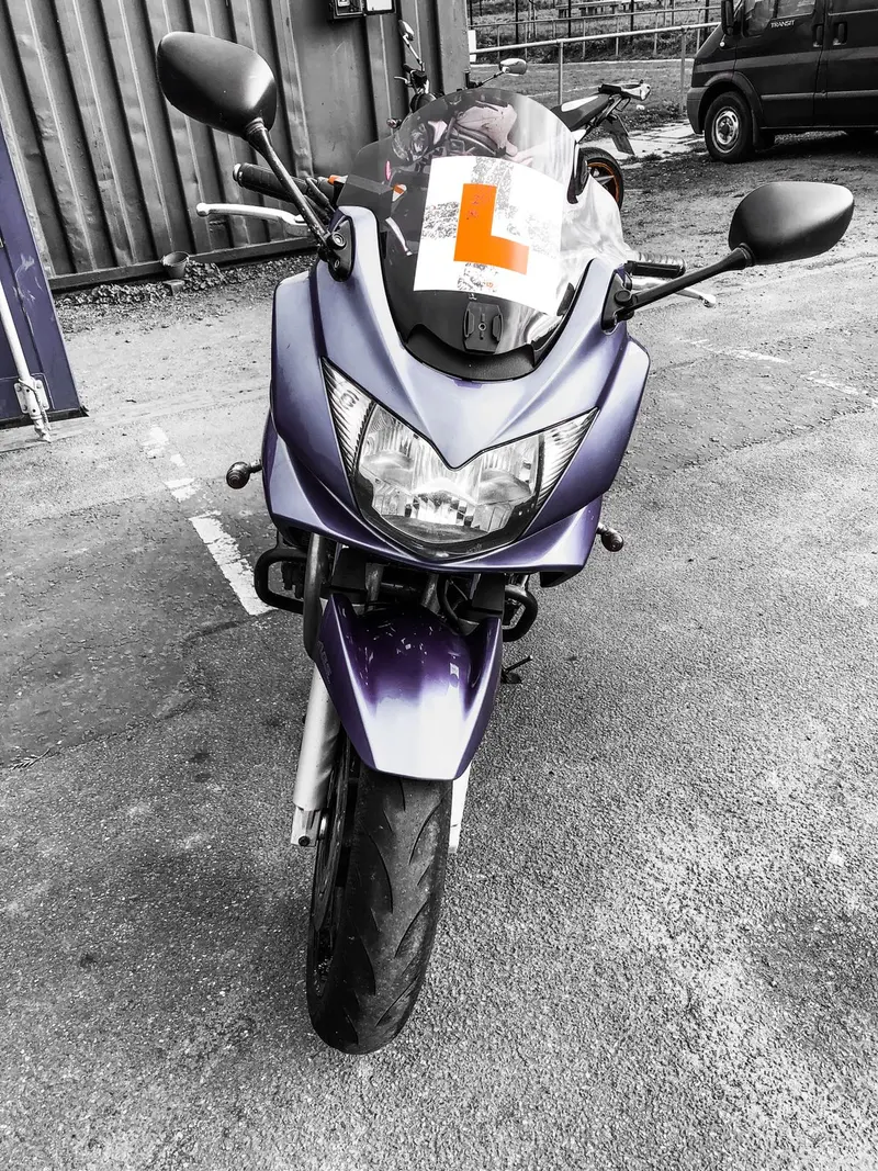 The front of a purple Suzuki Bandit