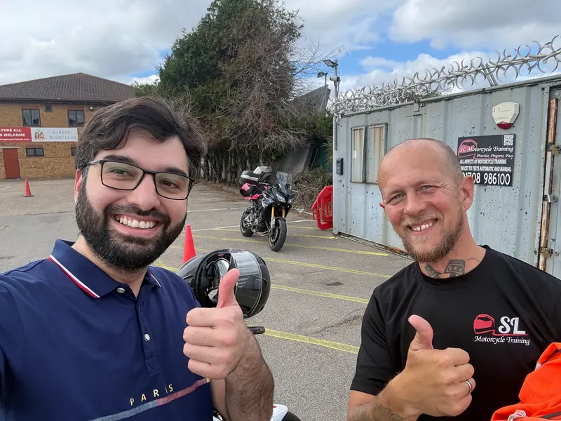 A student and instructor giving a thumbs up on the training ground