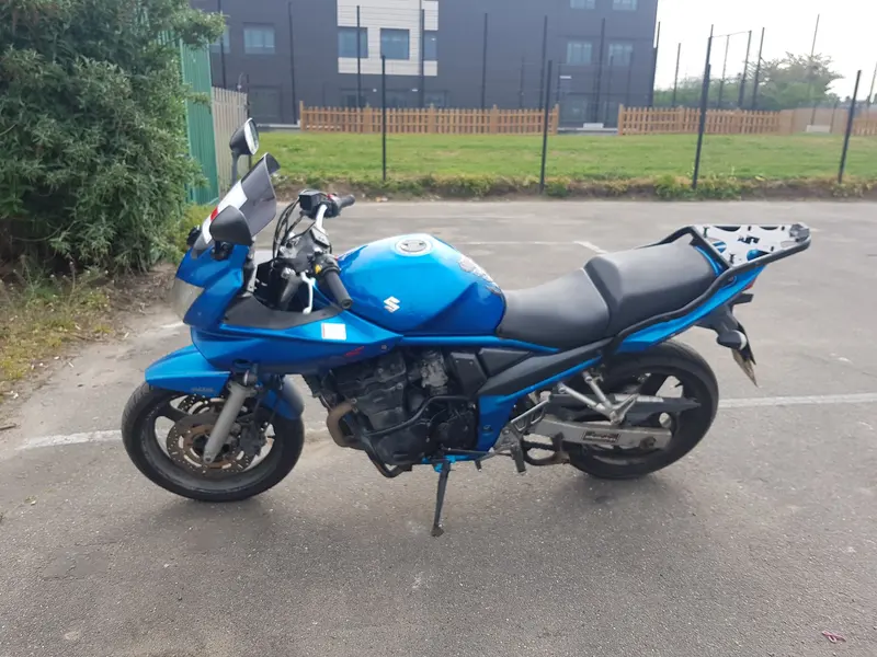 A blue Suzuki Bandit on the training ground